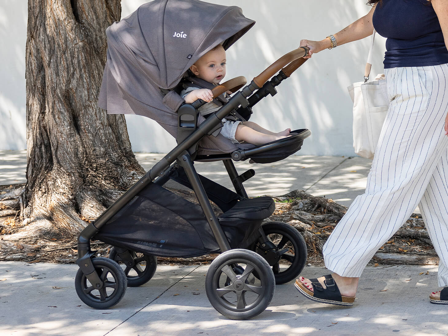 Family walking with Hazel 3-in-1 height adjustable all terrain stroller