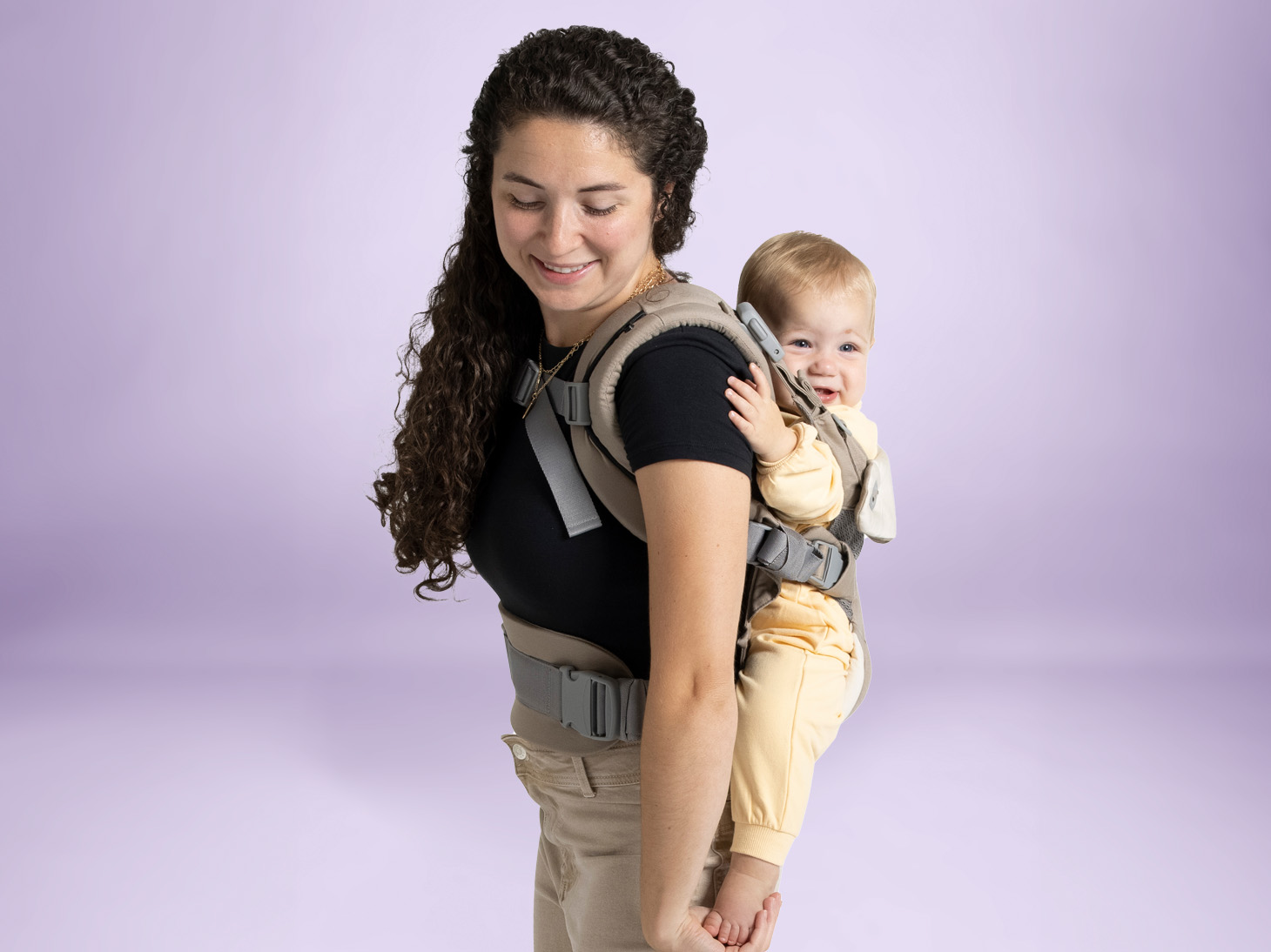 Baby in savvy 4-in-1 carrier on mom's back