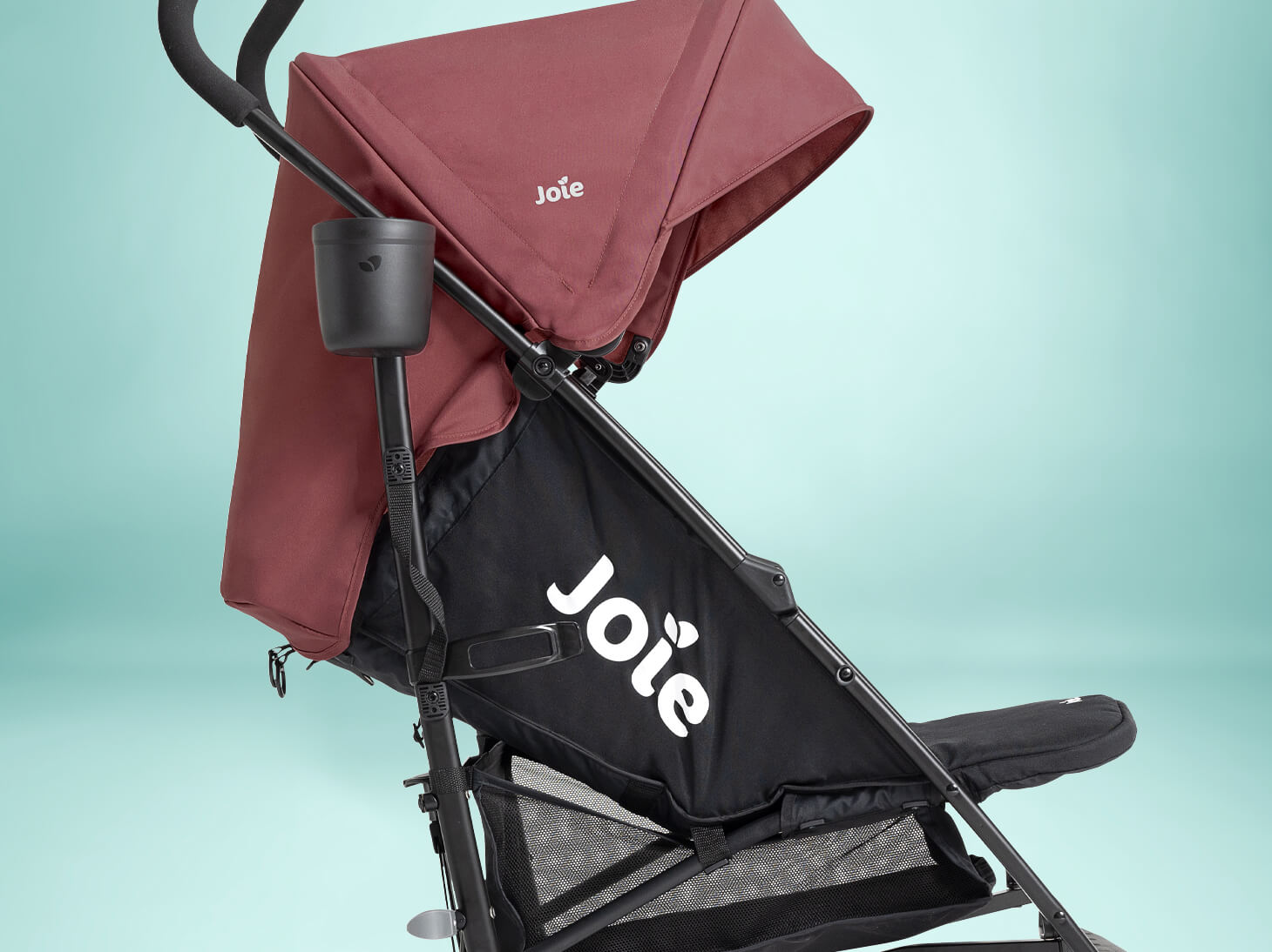 close up of recline on tansy lightweight umbrella stroller on mint background
