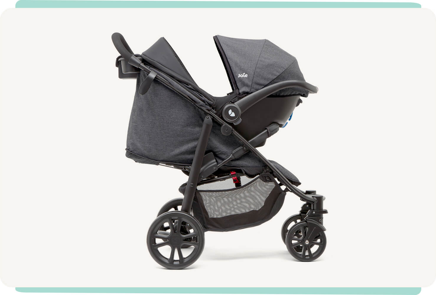   A black Joie Litetrax 4 travel system with the infant car seat attached to the stroller, facing toward the right in profile.