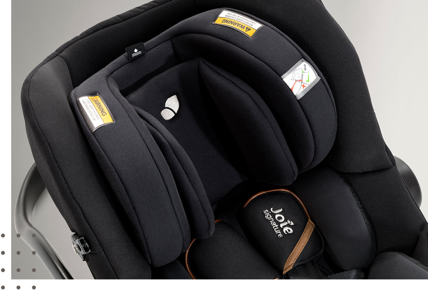 Gray Joie I-Gemm 2 infant car seat facing straight on with the canopy attached.