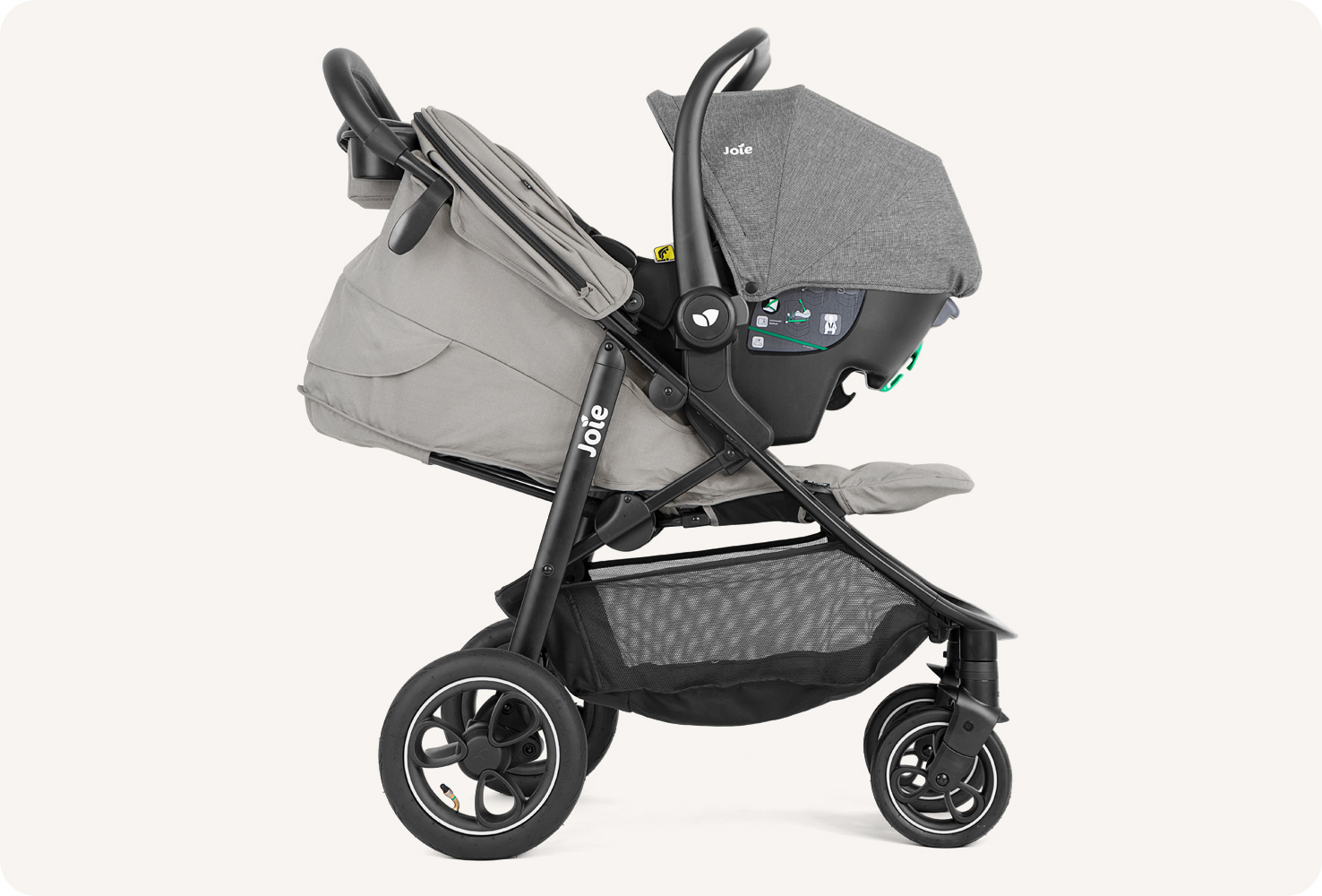  Joie litetrax pro air stoller in gray with infant carrier attached. 