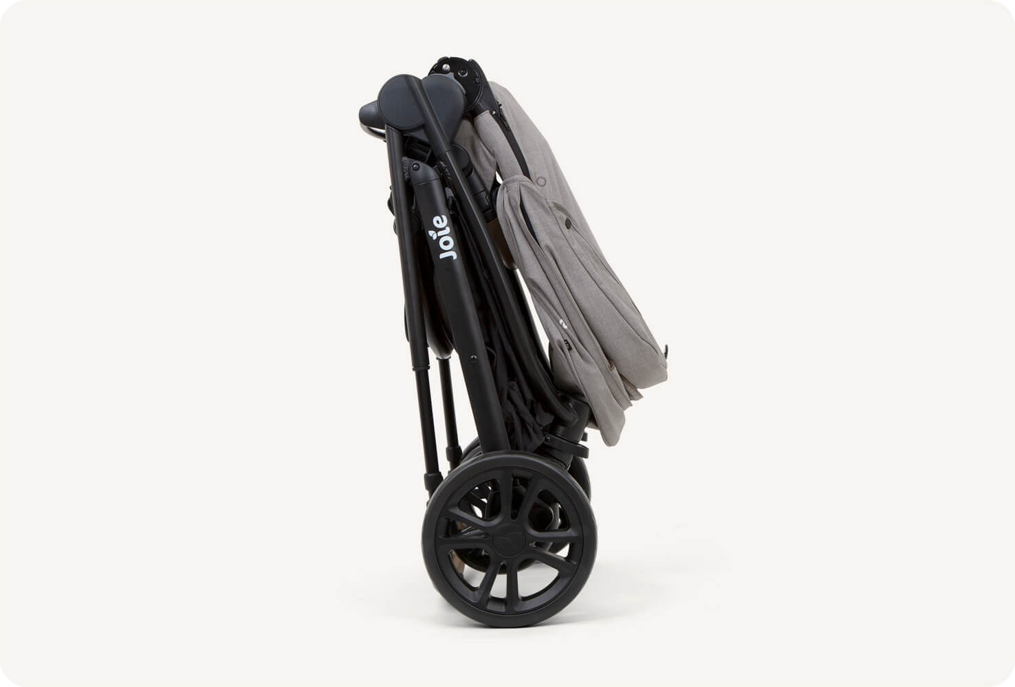 Gray folded versatrax e pram in profile.