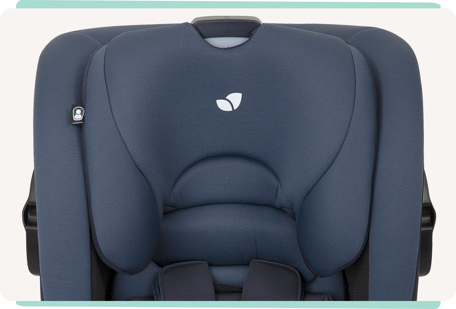 Close-up of the headrest on a dark blue Joie bold toddler car seat.