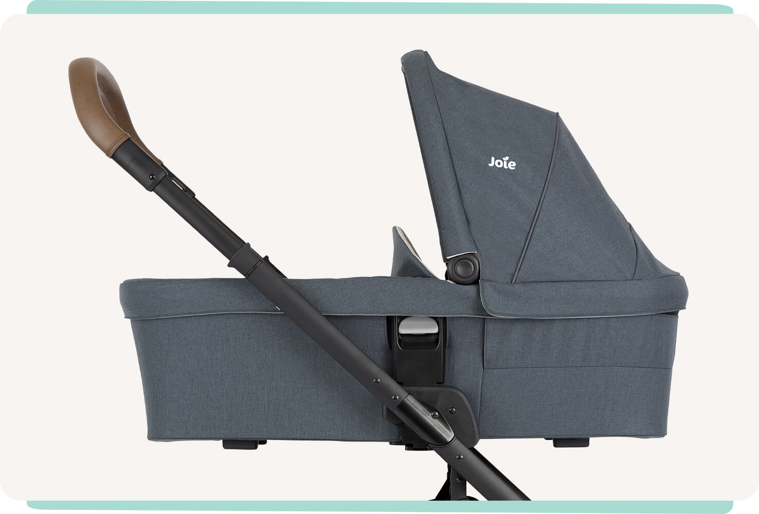 The Joie Chrome DLX pram with carry cot in blue at an angle facing to the right.
