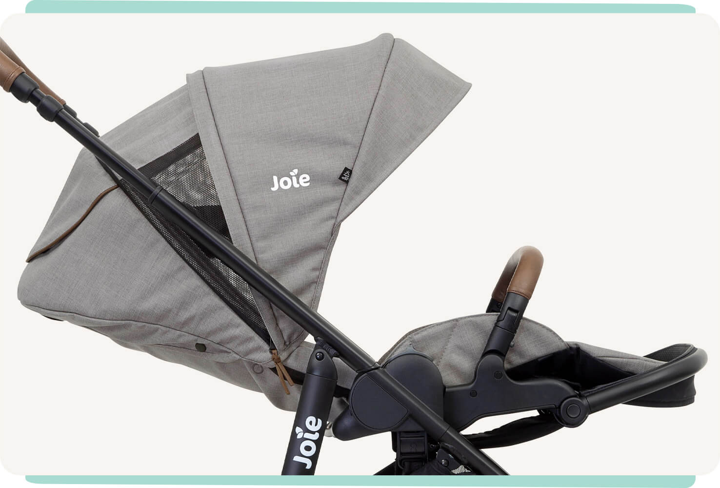 Zoomed in view of reclined position of the light gray and black Joie versatrax pram. 