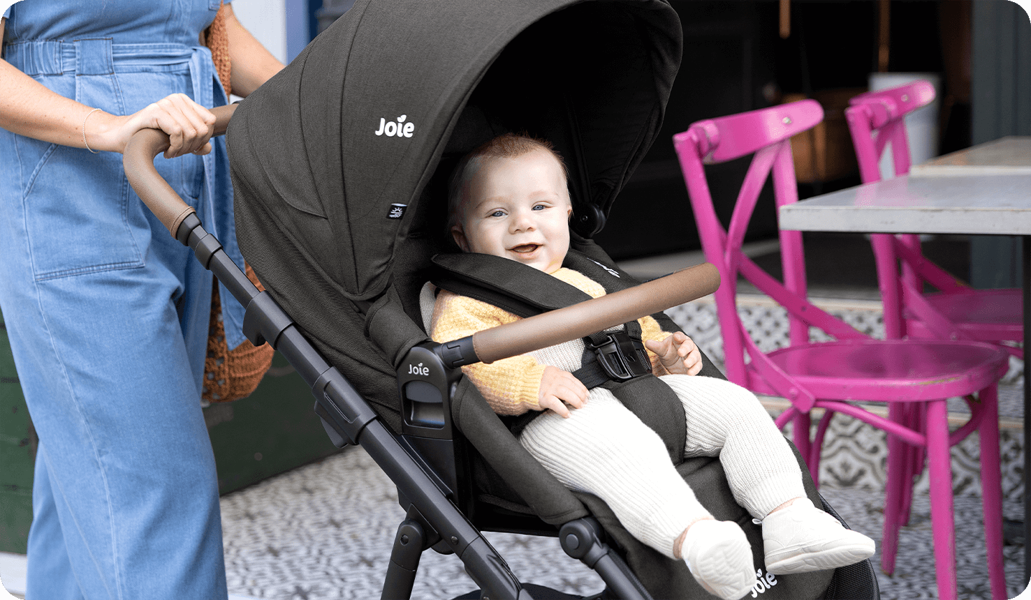 Happy baby in Joie alore stroller 
