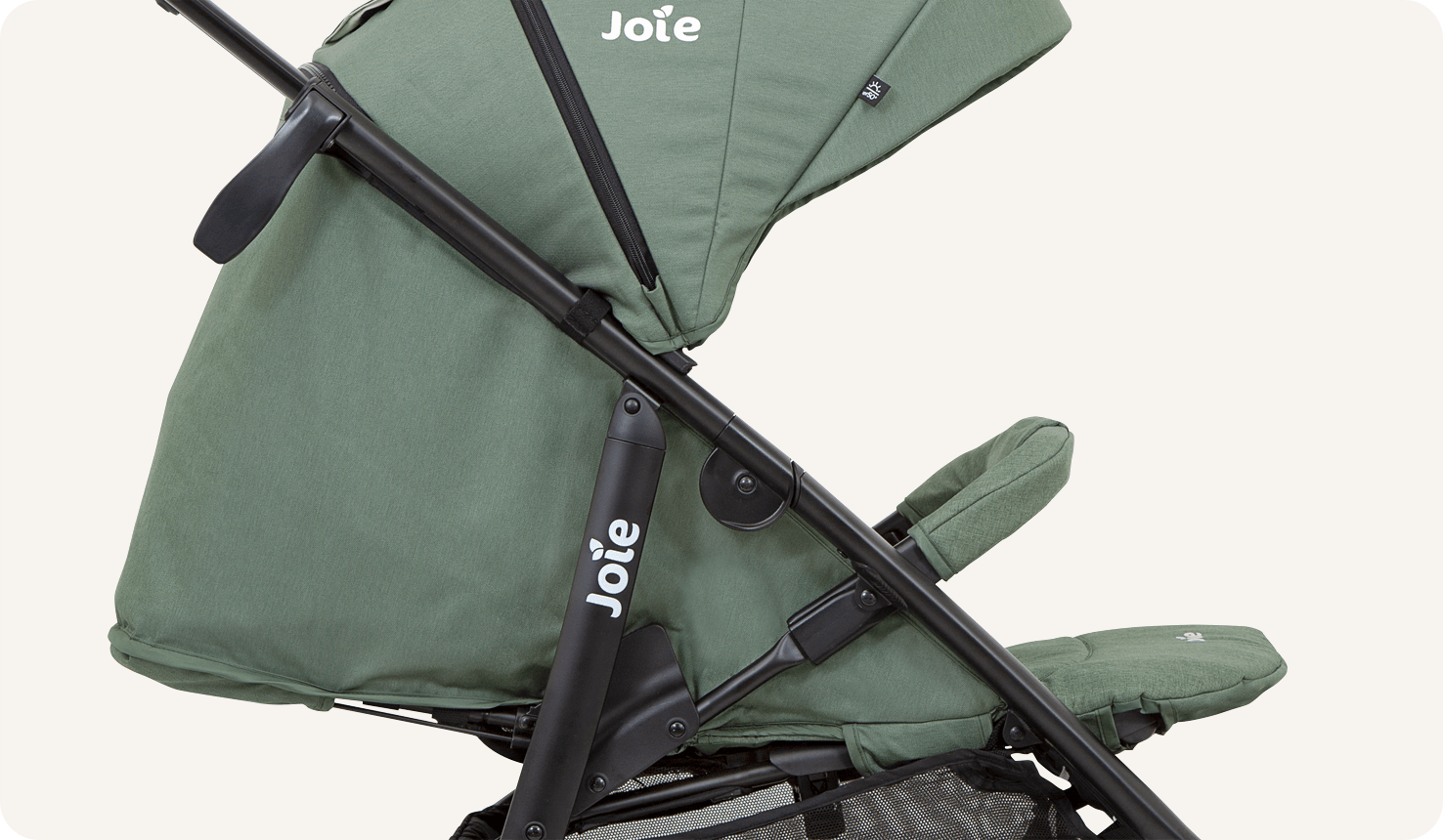 Closeup of a green litetrax 4 dlx stroller showing the flat recline.