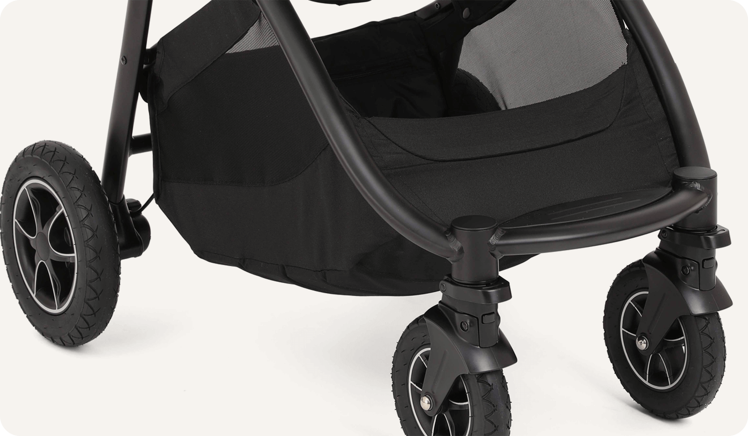 Zoomed in view of the storage basket on a Joie versatrax pram.