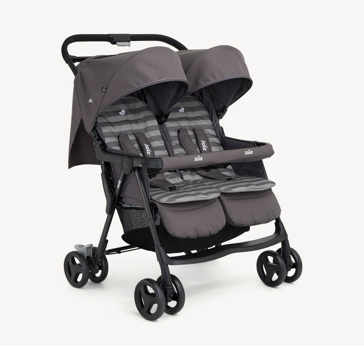  The Joie Aire Twin side-by-side double stroller in dark gray with two tone striped seat inserts, at an angle.