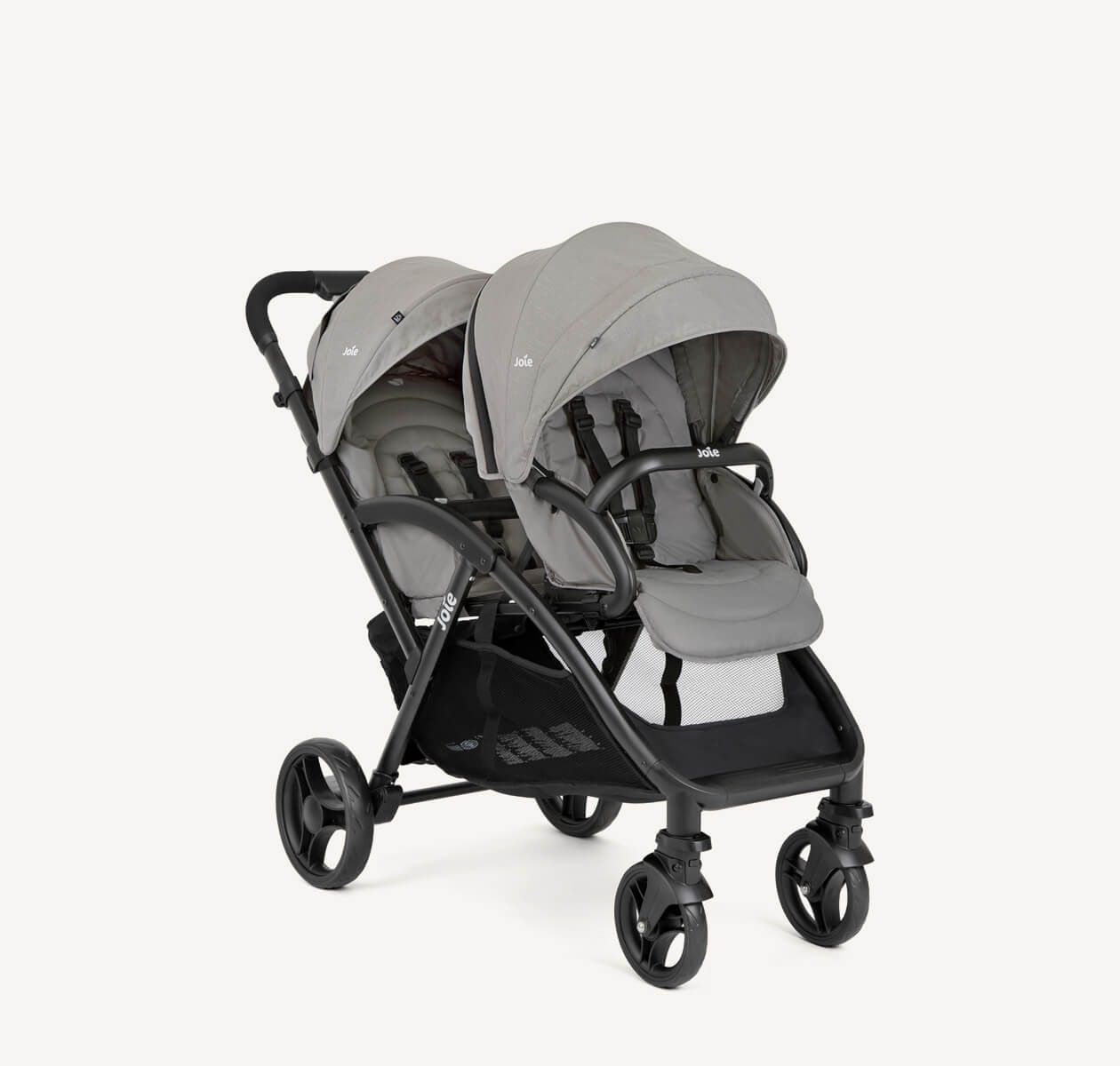 Cochecito doble Joie evalite duo gris en ángulo orientado a la derecha.