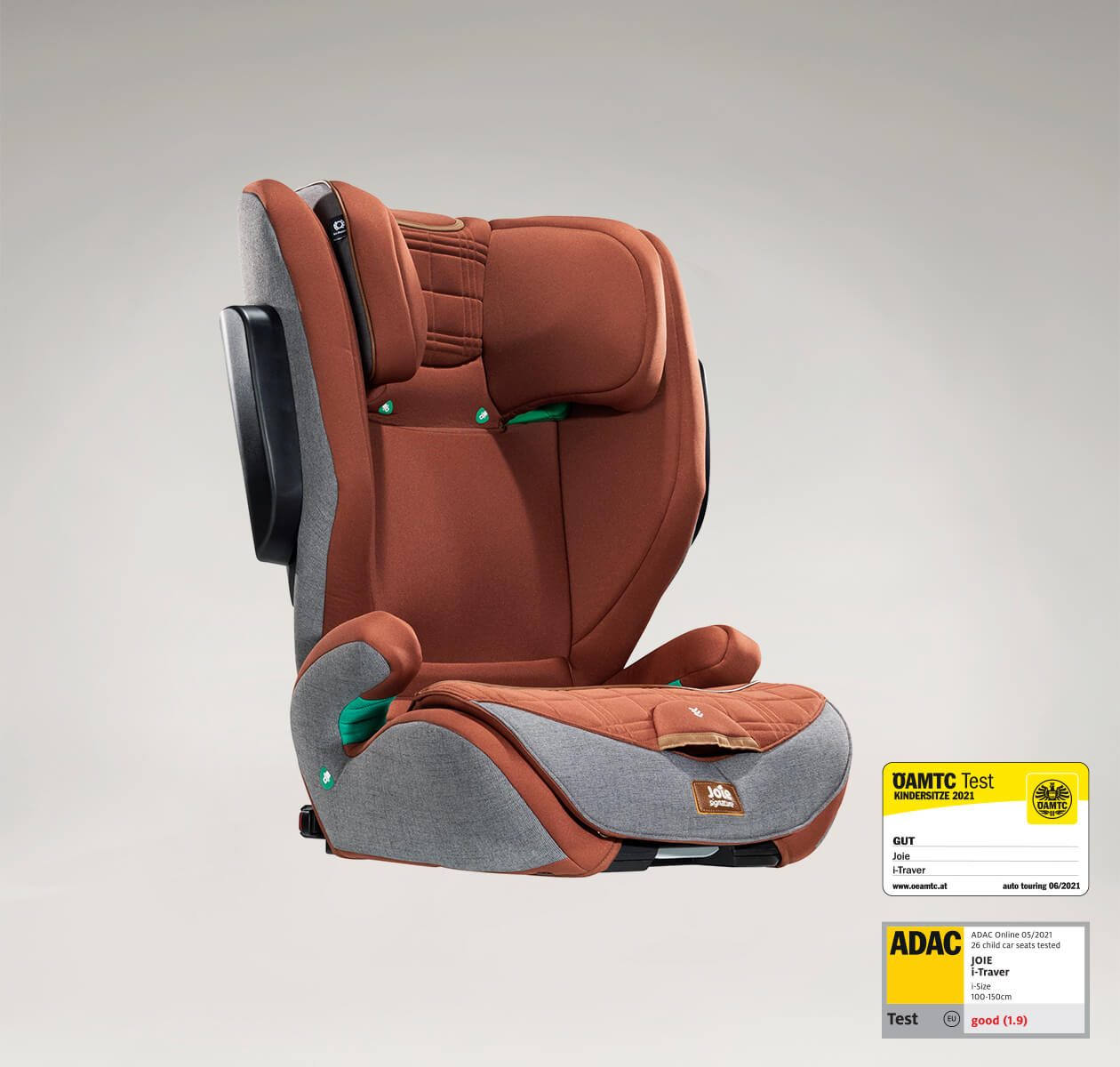 Joie i-Traver booster seat in dark blue at an angle, with the ADAC test label in the lower right corner.