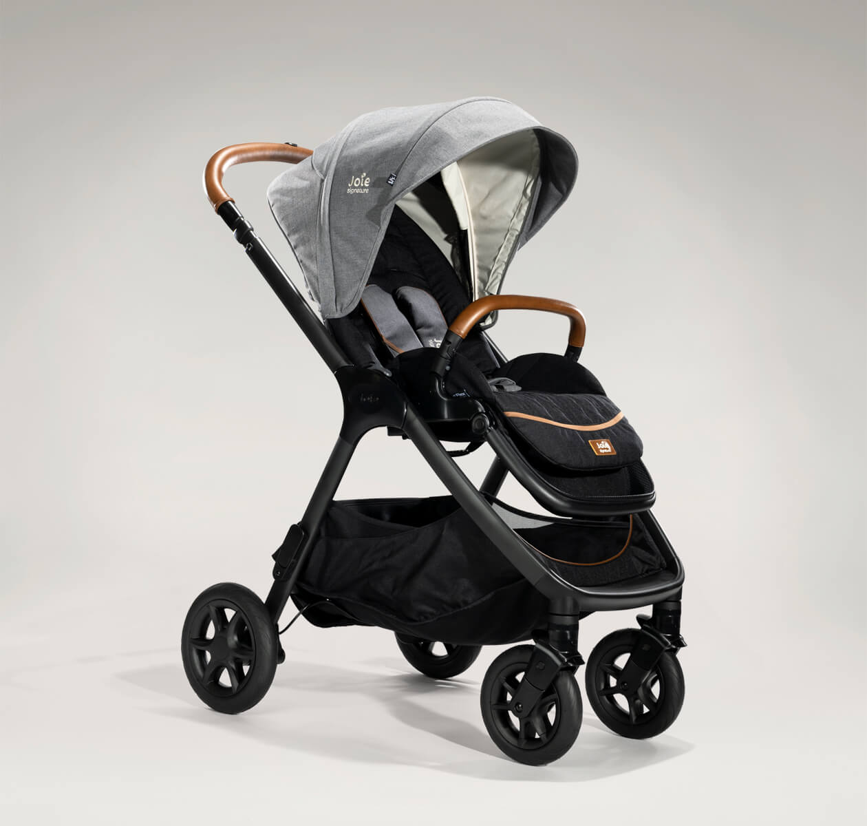  Joie finiti pram in black and gray at an angle. 