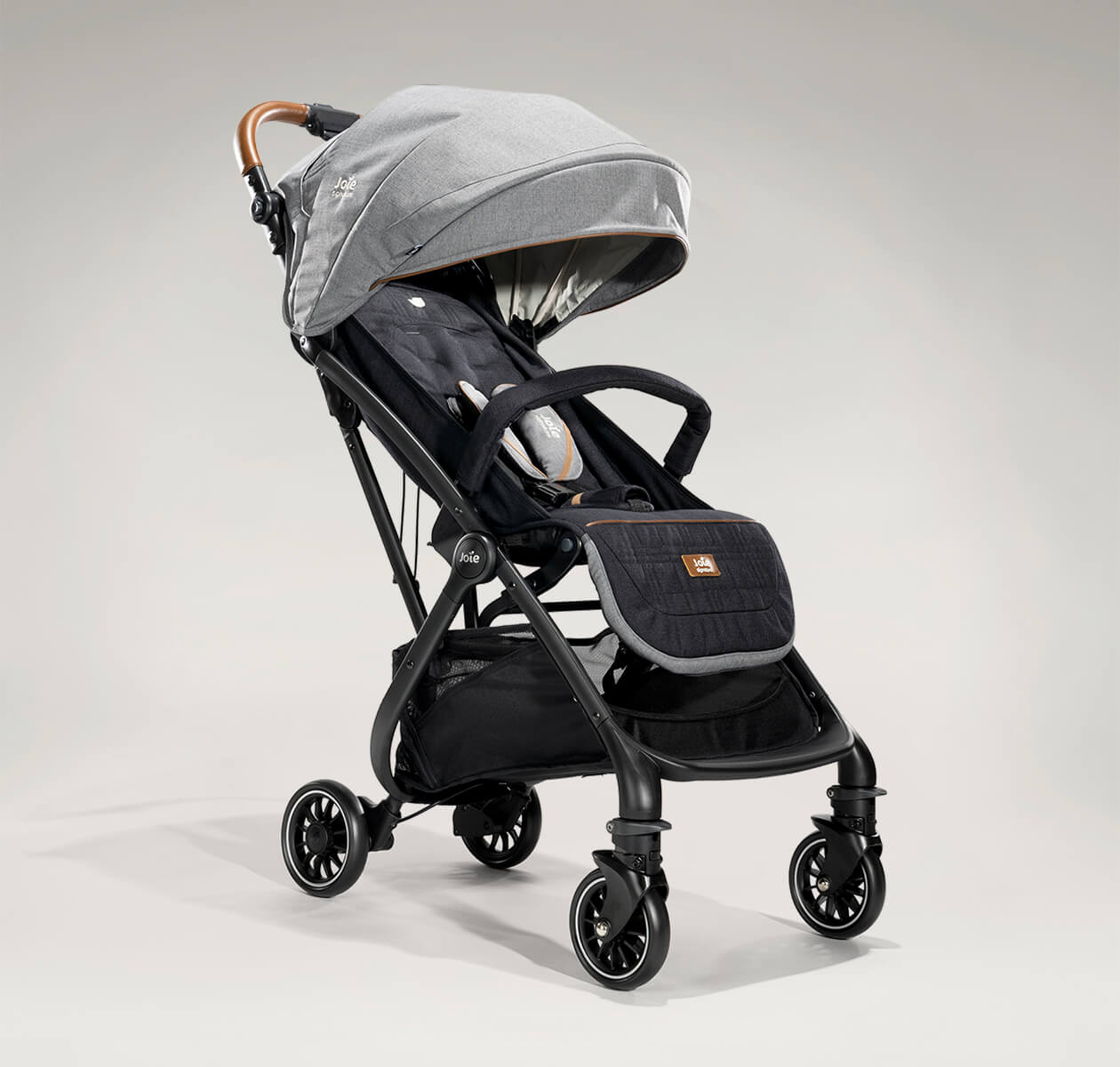  Joie tourist stroller in black and gray at an angle.