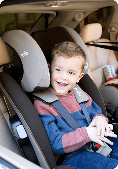 Toddler in the Joie armour FX spinning car seat
