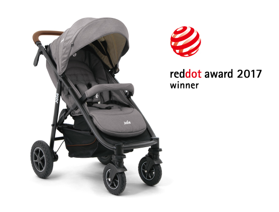 A gray Joie Signature i-Prodigi car seat at an angle facing to the right, with the Red Dot Design award logo above and to the right